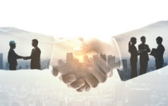 Handshake between suited people