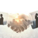 Handshake between suited people