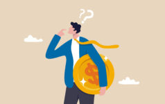 Animated image of a person holding a giant gold coin, from Getty Images.