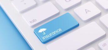 Image of an insurance key on a keyboard.