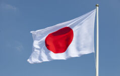 EY: Japan’s once in a lifetime investment opportuntity Flag of Japan on a windy day.