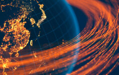 Asia-Pacific communication and data flow over the wireframe globe lit by lights on the surface of the planet