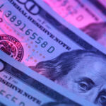 Hundred dollar bill in abstract lighting