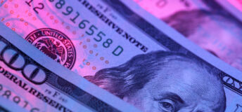 Hundred dollar bill in abstract lighting