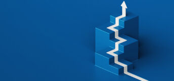 A white arrow painted on the blue floor climbs isometric steps