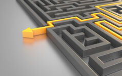 Advantage Partners on bringing a PE approach to public companies Orange colored path across a maze. ( 3d render )