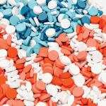 USA flag pill nation pills red white blue background health care medication 3d illustration render digital rendering