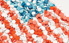USA flag pill nation pills red white blue background health care medication 3d illustration render digital rendering