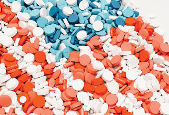 USA flag pill nation pills red white blue background health care medication 3d illustration render digital rendering