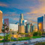 LA Fire and Police Pension reaffirms conviction in lower mid-market, emerging managers Dusk light with dramatic clouds in downtown Los Angeles and freeway, California.