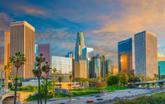 LA Fire and Police Pension reaffirms conviction in lower mid-market, emerging managers Dusk light with dramatic clouds in downtown Los Angeles and freeway, California.