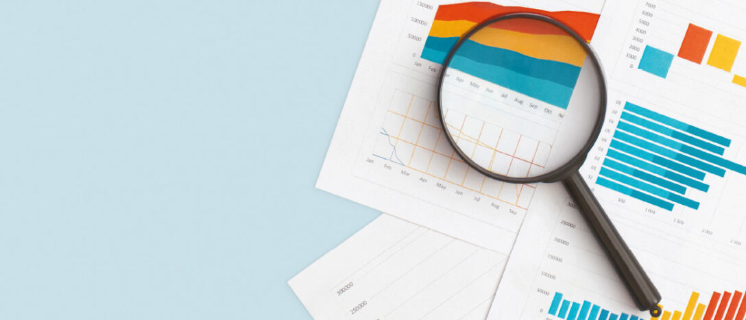 T9 labour of law firms image A magnifying glass lies on top of several documents of infographics