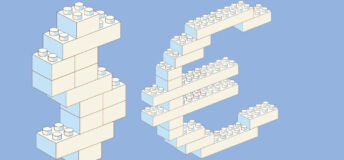 Toy building blocks in the shape of a dollar sign and euro sign