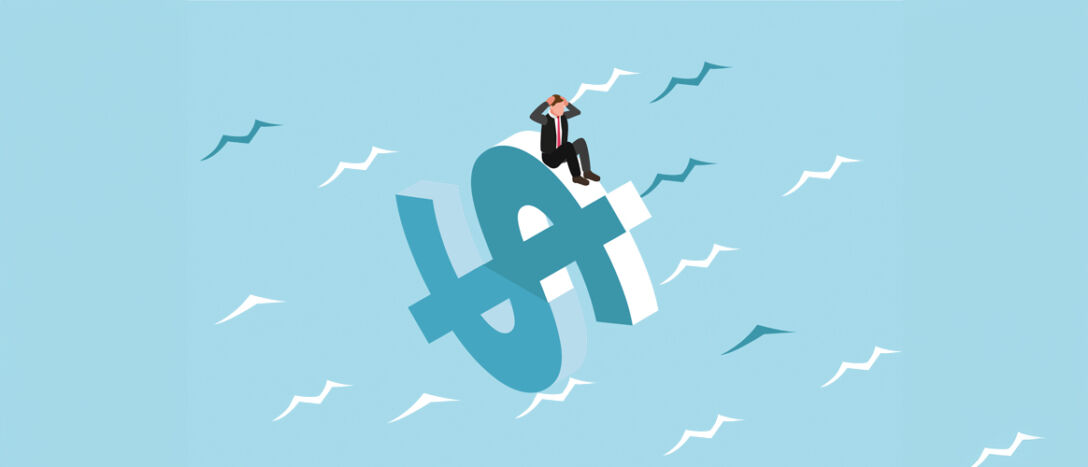 T9_dollar sign Dollar life raft with a businessman sitting on top of it clutching his head in despair