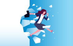 woman breaking through glass in business suit