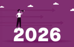 Woman looking ahead to 2026 with binoculars