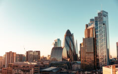Sun setting over buildings in London