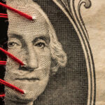 Stressed out: How private equity is weathering higher-for-longer PEI Feb26 cover image torn US dollar bill