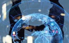 shaking hands behind a globe