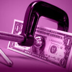 Side Letter: Stress test A clamp grips onto a stack of dollar bills