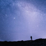Man staring at a starry sky