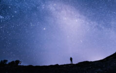 Man staring at a starry sky