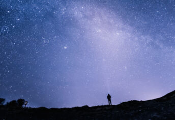 Man staring at a starry sky