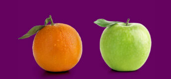orange and an apple against a purple background