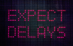 Side Letter: Self-inflicted illiquidity? An image of a traffic sign that reads "Expect delays"